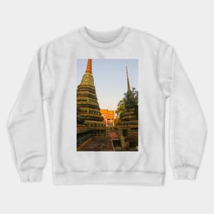 First sidewalk view to ornate roof, flanked from parts of Chedis at Wat Pho. Crewneck Sweatshirt